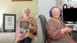 Cath Bowie mit Guinness-World-Records-Urkunde an ihrem Gaming-Setup