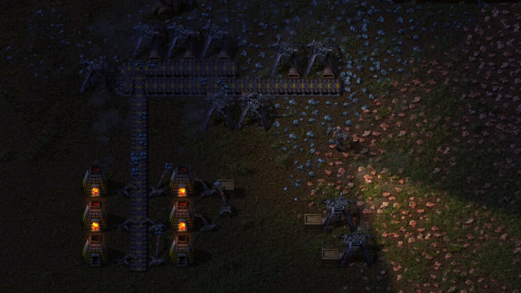 Factorio-Fabrik bei Nacht mit Erzfeldern, Öfen und Förderbändern