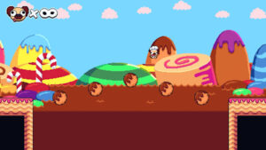 Pogui hüpft über bunte Süßigkeitenplattformen in einer Retro-Pixel-Art-Welt