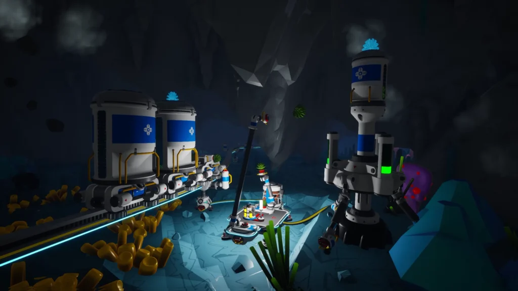 Beleuchtete Behälter- und Fördertechnik in einem unterirdischen Astroneer-Außenposten.
